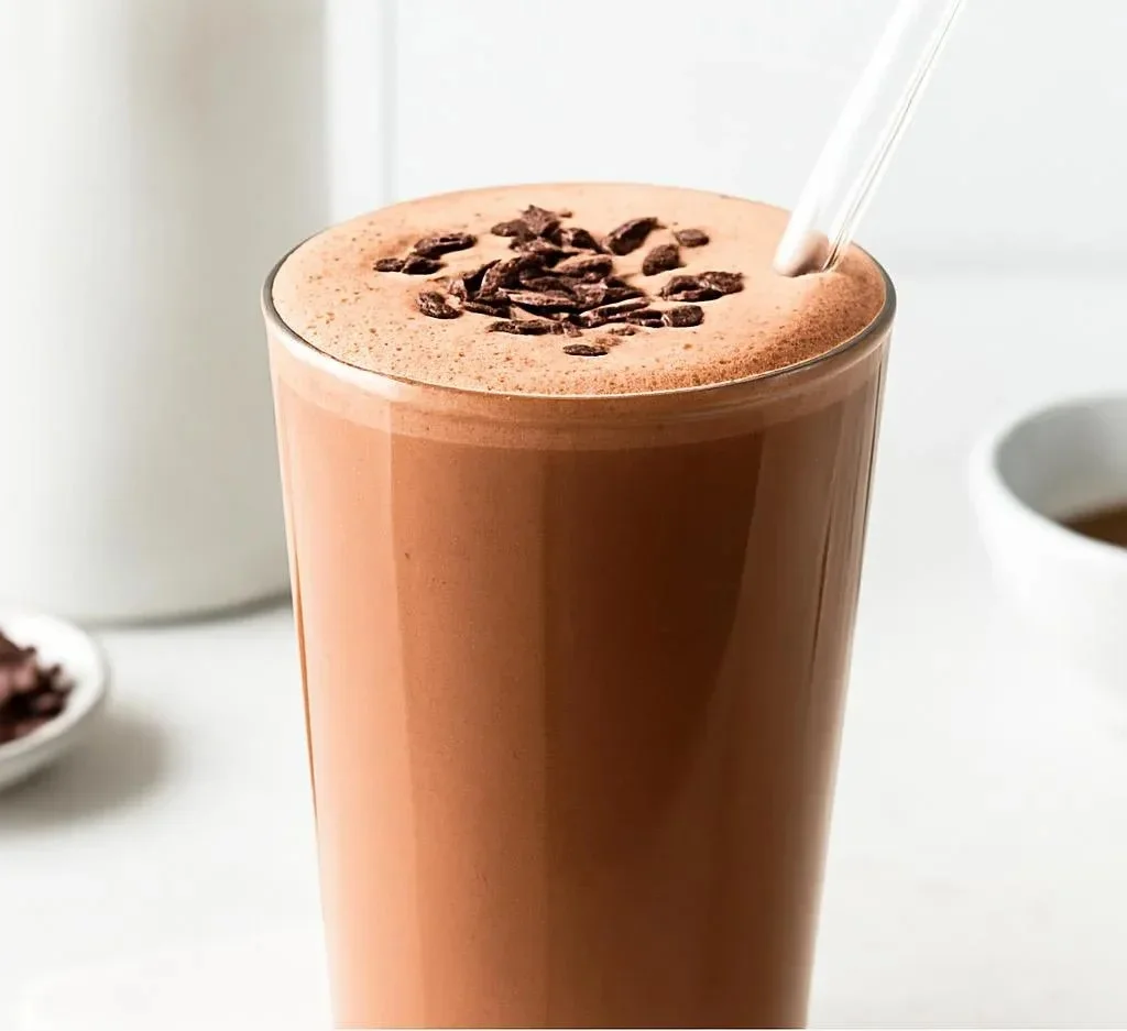 Creamy and nutritious tofu smoothie in a glass with fruits and greens