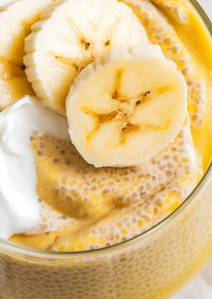Banana coconut milk chia seed pudding topped with fresh banana slices.