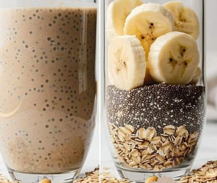 Chia seed smoothie in a glass, topped with fruits and seeds.