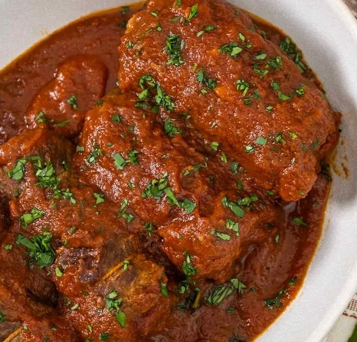 Delicious Italian Braciole served with rich sauce and herbs
