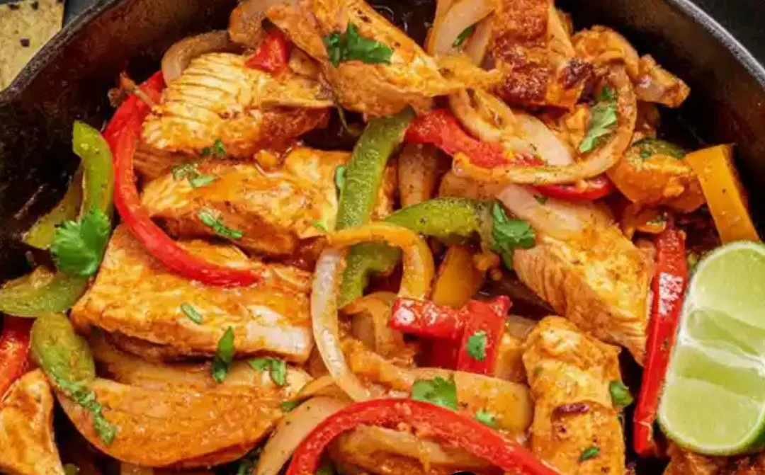Skillet-cooked chicken fajitas with colorful bell peppers and onions