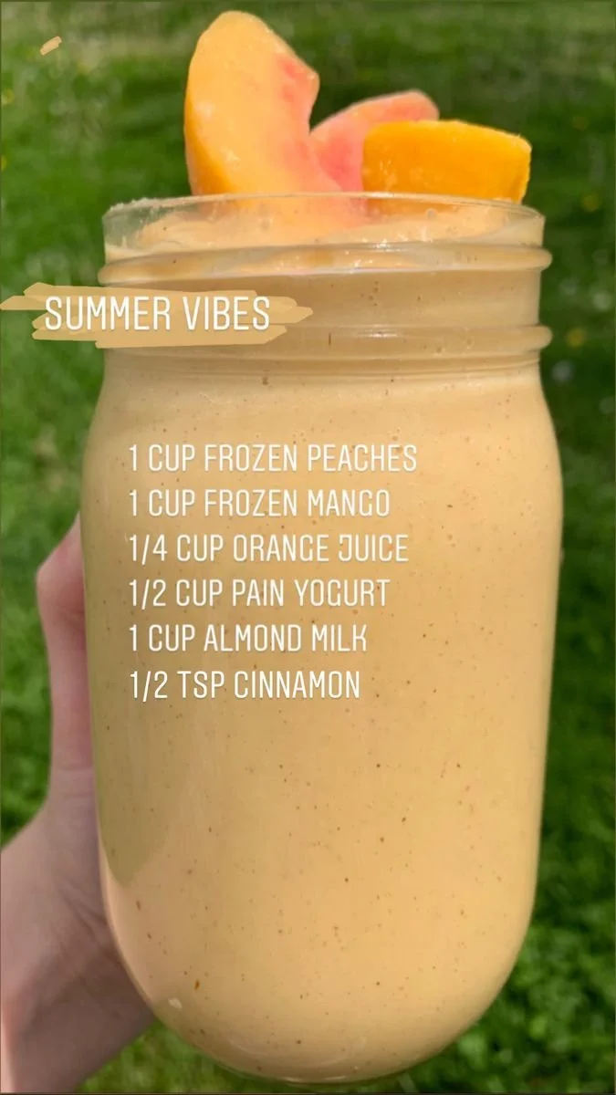 A vibrant fruit smoothie in a glass, showcasing healthy ingredients for breakfast.