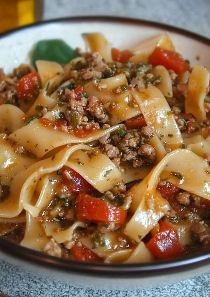 Italian Drunken Noodles with vibrant vegetables and spices in a bowl