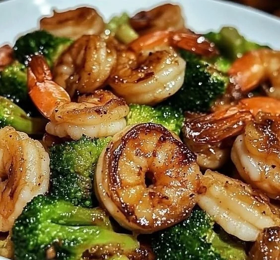 High-protein honey garlic shrimp dish served with vegetables.
